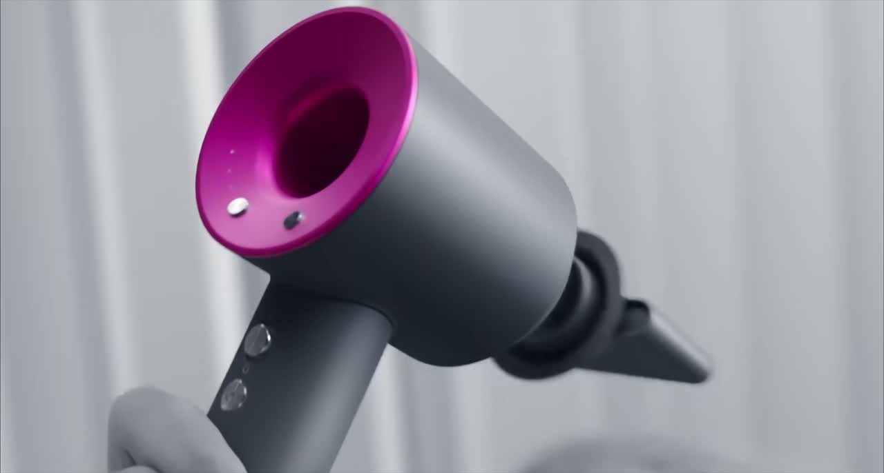 The Dyson Supersonic hair dryer being used to style hair